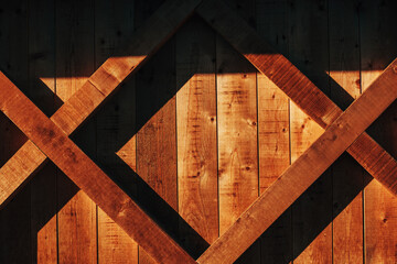 Brown wooden background, with shadow and light pattern