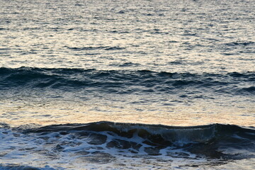 small waves at greek island kalymnos at sunset