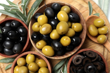 Olives in wooden bowls on the table