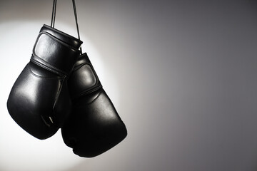 Black boxing gloves on a white background