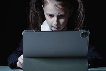 Lack of sleep as result of studying at night may impair children's mood, increase stress and anxiety levels and decreased cognitive abilities. Portrait of young girl studies at night.