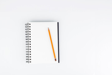 business notepad with pencil on white background