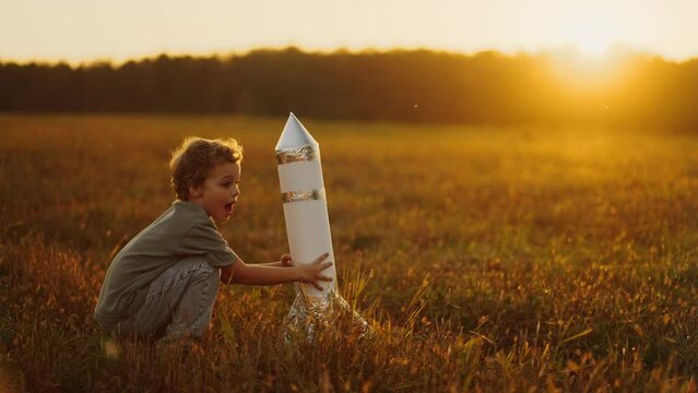 Children Game, Little Boy Playing With Toy Rocket In Field In Summer Vacation, Future Astronaut