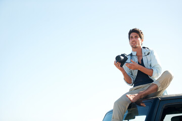 Man, photographer or camera on car outdoor for road trip, adventure or journey on rooftop with travel. Person, photography or memories for vacation, holiday or scenery in Asia or sky mockup in nature