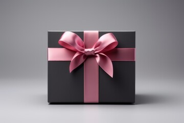 Pink gift box with ribbon bow.