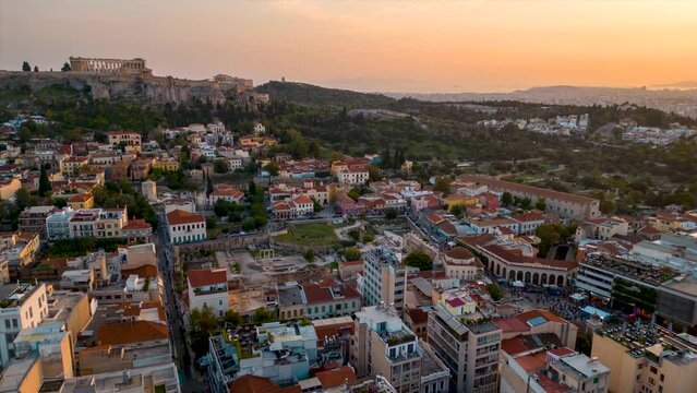 Aerial hyper lapse view of the skyline of Athens, Greece, with old town Plaka, Monastiraki square and the Acropolis during sunset
