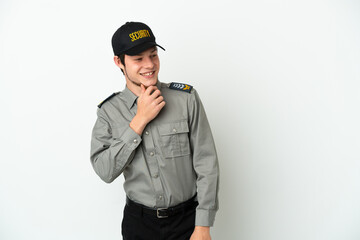 Young Russian security man isolated on white background looking to the side and smiling