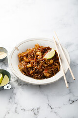 Traditional noodles with shrimps and lime