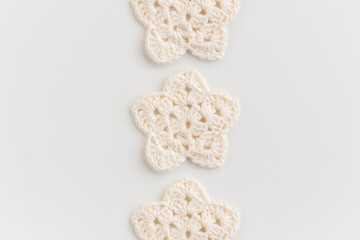 White crocheted stars row pattern on a white background.