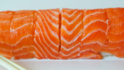 Japanese red fish salmon rolls are in a white package.