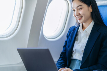 Woman working and update with calendar, schedule, timetable, and management, event planning sitting in airplane.