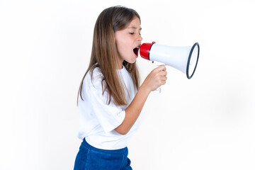 Beautiful kid girl wearing white T-shirt Through Megaphone with Available Copy Space