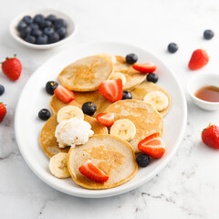 Homemade pancakes with banana and berries