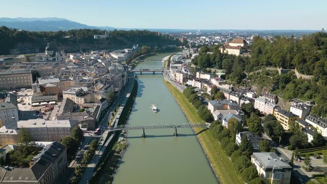 Drone Descends to Reveal Pedestrian Bridge over River Salzach in Salzburg, Austria