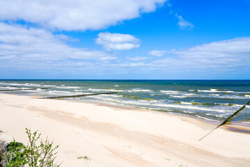 Beach near Trzesacz in Poland. Natural coast on the Polish Baltic Sea with white sand. Landscape by the sea in West Pomerania.