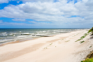 Fototapeta na wymiar Beach near Trzesacz in Poland. Natural coast on the Polish Baltic Sea with white sand. Landscape by the sea in West Pomerania.