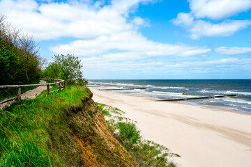 Beach near Trzesacz in Poland. Natural coast on the Polish Baltic Sea with white sand. Landscape by the sea in West Pomerania.