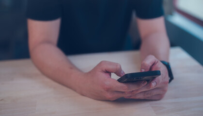 Social media marketing concept. man hand using smartphone typing, chatting conversation in chat box icons pop up