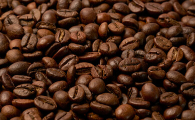 Black coffee and coffee beans on Wooden table