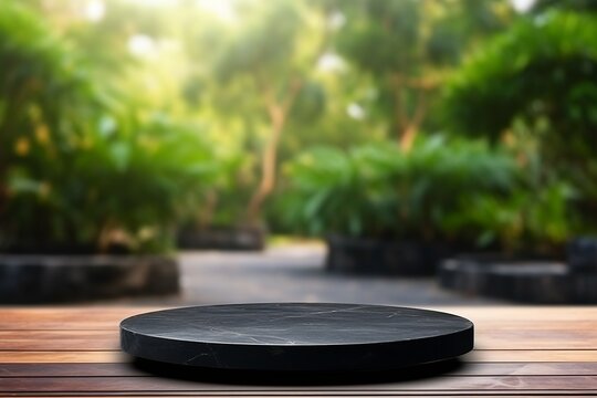 Empty Black Stone Table Top and Blurred Tree Garden Background - High Quality Photo
