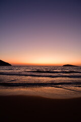 Naklejka na ściany i meble sunset long exposure waves sand greece europe