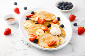 Homemade pancakes with banana and berries