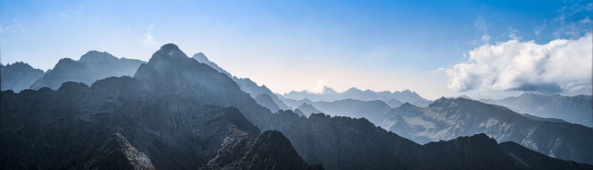 A panoramic view of the rocky mountain tops in the High Tatras. - obrazy, fototapety, plakaty