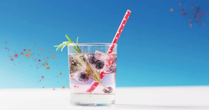 Animation of confetti falling and cocktail on blue background