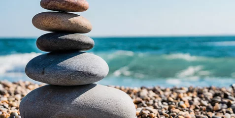 Foto op Plexiglas stone tower natural pebble stone on the beach balancing body mind soul and spirit mental hea © Emanuel