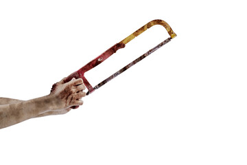 The hand of a scary zombie with blood and wounds carrying a saw