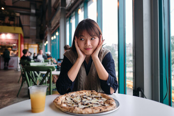 The Joyful Expression of a Young Woman Ready for Pizza