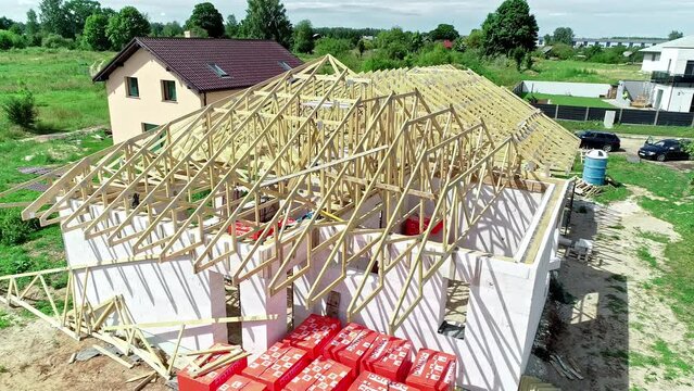 Aerial footage of under construction house being built adjutant to another house