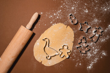 Raw Christmas Cookies. The process of making gingerbread with cookies cutters.