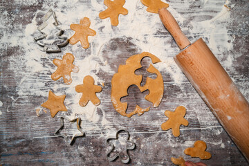 Raw Christmas Cookies. The process of making gingerbread with cookies cutters.