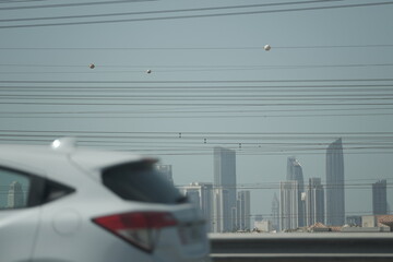 high power line constructions with Dubai in background