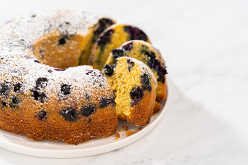 Lemon blueberry bundt cake with powdered sugar dusting