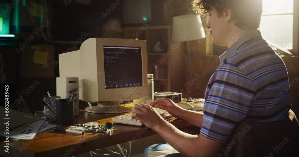 Poster Caucasian Male Computer Engineer Programming On Old Desktop Computer In Retro Garage. Experienced Software Developer Writing Code For New Innovative Portable Device Startup In Nostalgic Nineties.