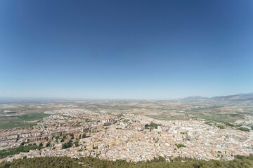 Fototapeta na wymiar Panoramic view of the city of Jaen. Wide angle 14mm. Spectacular landscape with the city of Jaen.