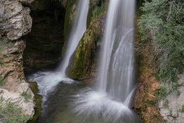 Fototapeta na wymiar Strong waterfall in the Alto Tajo mountain range