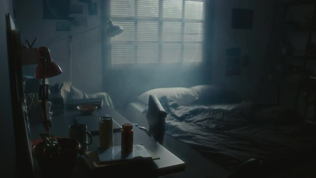 Interior of dark bedroom with pills on desk, no people there. Depression concept