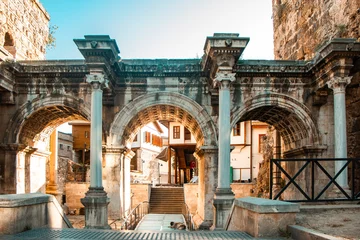 Deurstickers Oude deur ANTALYA, Turkey: Hadrian Gate with all its majesty and historical textures. An ancient structure made of marble and limestone.