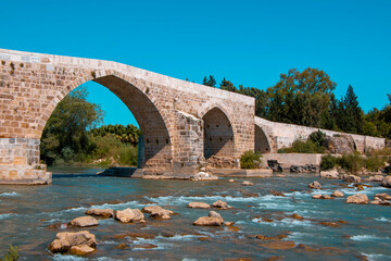 Bridge over the Koprucay river near the ancient city of Aspendos in Antalya province of Turkey.