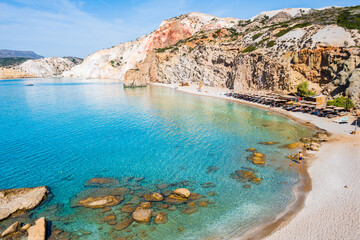 Fototapeta premium View of beautiful sandy Fyriplaka beach with azure sea water, Milos island, Cyclades, Greece