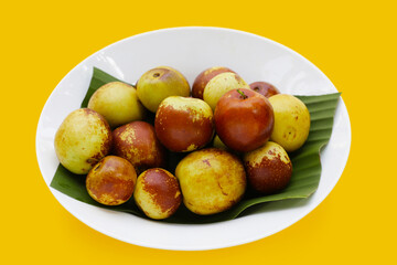 Fresh jujube fruit on yellow background