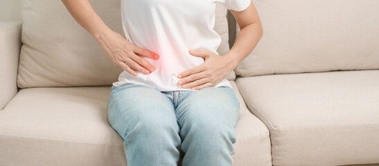 woman having abdomen ache due to Stomach pain, digestion with constipation or Diarrhea from food...