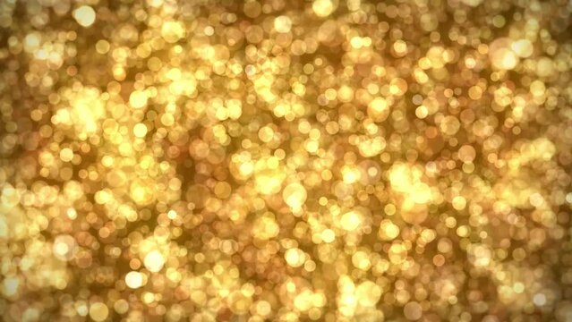 Abstract Christmas background of a blurred bokeh of animated golden light particles in a seamless loop

