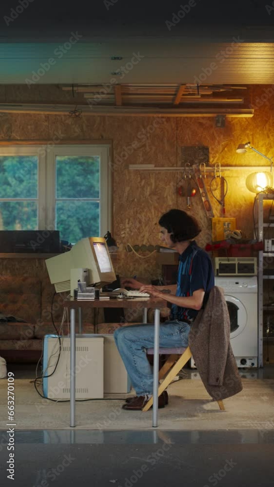 Fototapete Vertical Screen: Caucasian Male Software Engineer Programming On Old Desktop Computer In Retro Garage In The Evening. Ambitious Man Starting an Innovative Fintech Startup Company In Nostalgic Nineties