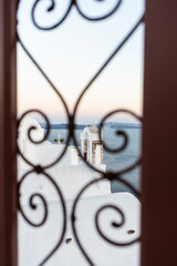 Window frame on a beautiful coastal landscape in the Mediterranean Sea in Santorini, Greece