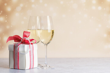 Two champagne glasses and gift box