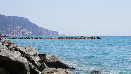 Fototapeta na wymiar The view from the Rin Tin Beach in Pietra Ligure in Italy, in the month of May